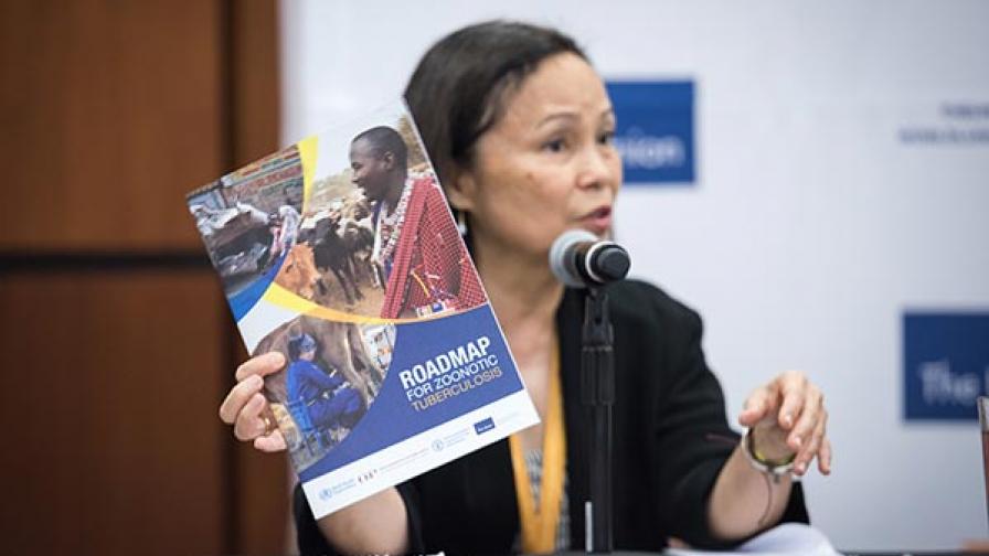 Dr Paula I Fujiwara holds up a copy of the Roadmap for Zoonotic Tuberculosis during a press conference at the Union World Conference in October.